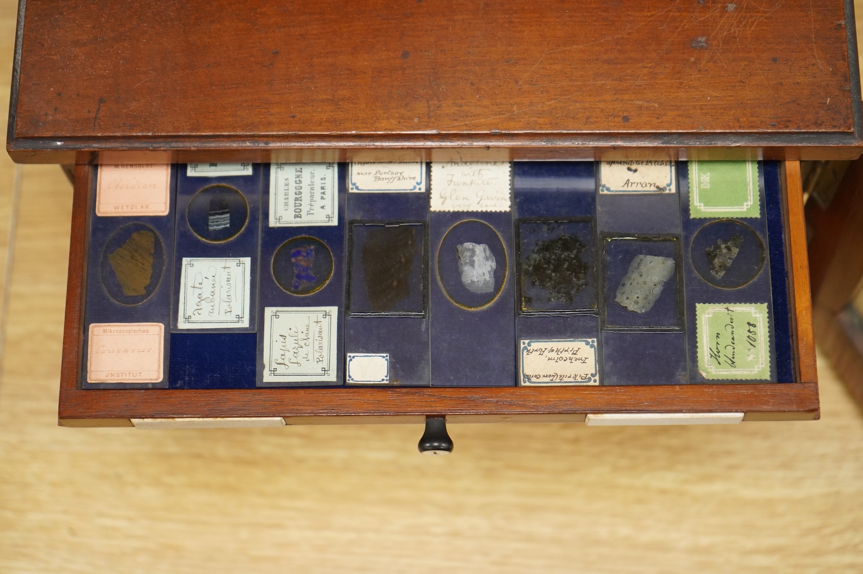 A 19th century mahogany cased slide box, fitted with 13 slide trays, housing approximately 290 slides of mineral, plant, animal and fossil specimens, 26cm wide, 19cm high, 29.5cm deep CITES Submission reference 514GC1XX